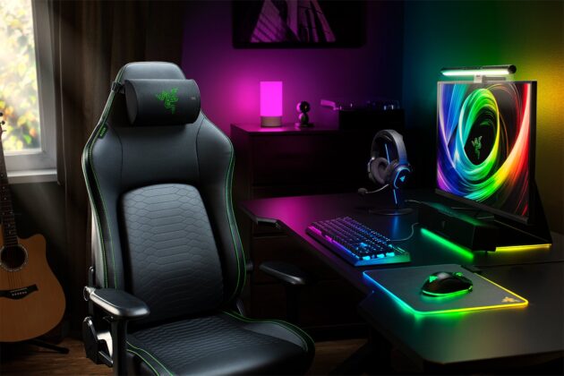 Razer gaming chair with the Clio X cushion in a purple-lit desk setup
