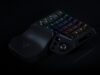Razer Tartarus V2 Pro one-handed gaming keypad with numbered RGB keys, a thumbstick and a leather-look wrist rest on a black background