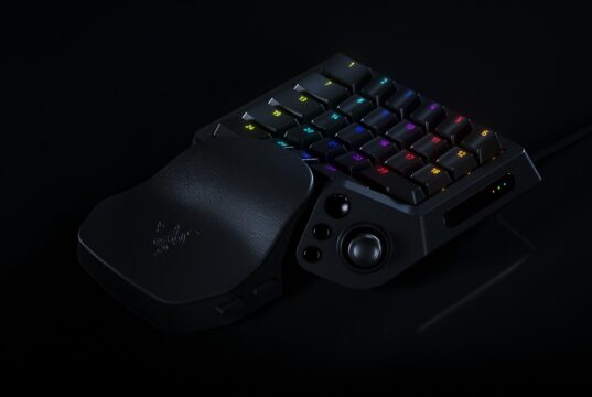 Razer Tartarus V2 Pro one-handed gaming keypad with numbered RGB keys, a thumbstick and a leather-look wrist rest on a black background