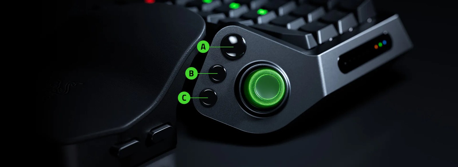 Close-up of the Razer Tartarus V2 Pro thumb cluster with a green-lit TMR thumbstick and three round buttons labeled A, B and C