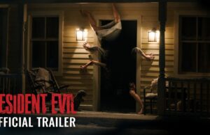 Resident Evil Movie Opens Today as Zach Cregger’s R-Rated Reboot Earns Early Praise A figure contorted upside down in the doorway of a lit farmhouse porch at night, from Sony's Resident Evil official trailer