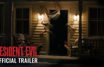 Resident Evil Movie Opens Today as Zach Cregger’s R-Rated Reboot Earns Early Praise A figure contorted upside down in the doorway of a lit farmhouse porch at night, from Sony's Resident Evil official trailer