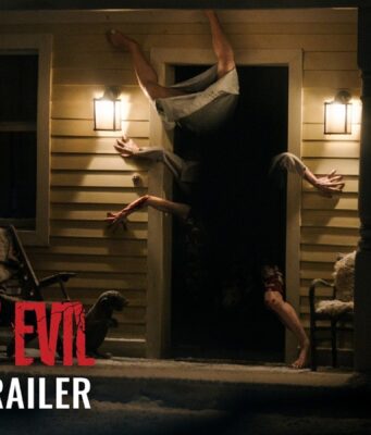 Resident Evil Movie Opens Today as Zach Cregger’s R-Rated Reboot Earns Early Praise A figure contorted upside down in the doorway of a lit farmhouse porch at night, from Sony's Resident Evil official trailer