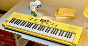 Roland GO:KEYS 3 Minion yellow keyboard with Minions illustrations on a desk