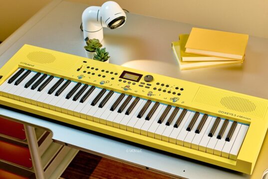 Roland GO:KEYS 3 Minion yellow keyboard with Minions illustrations on a desk