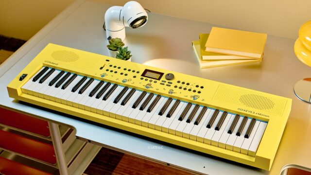 Roland GO:KEYS 3 Minion yellow keyboard with Minions illustrations on a desk