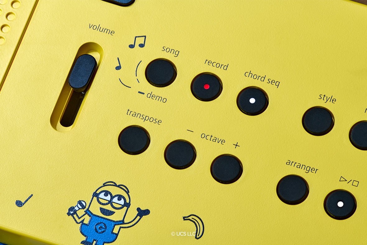 Child playing the yellow Roland GO:KEYS 3 Minion keyboard on a desk