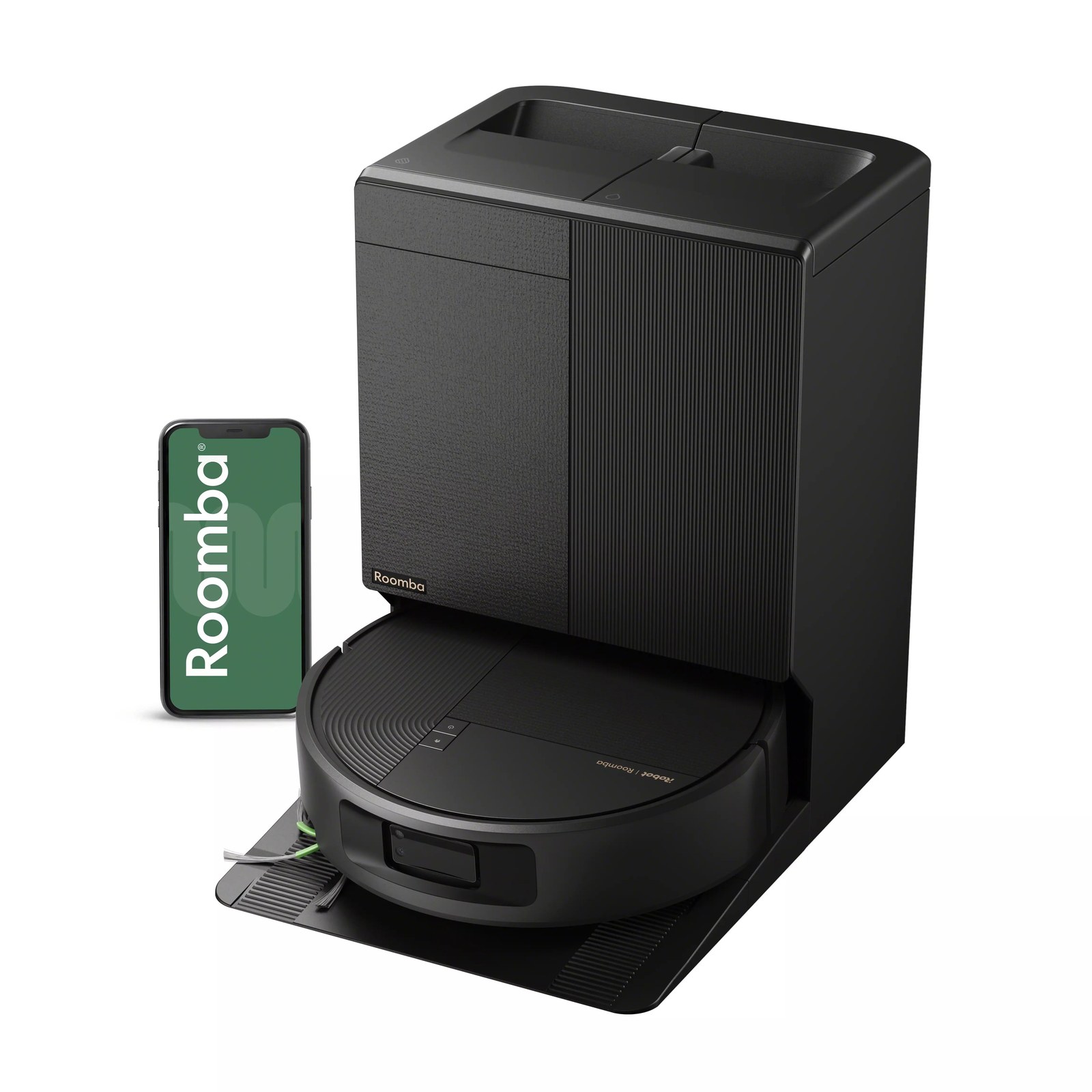 Roomba Plus 678 Combo robot docked at its AutoWash Dock next to a phone running the Roomba Home app