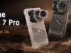 RugOne Xsnap 7 Pro snaps off an action camera at IFA Sand and dark gray RugOne Xsnap 7 Pro phones with a detached cube action camera over desert dunes