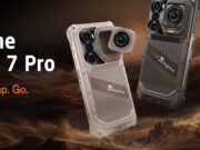 RugOne Xsnap 7 Pro snaps off an action camera at IFA Sand and dark gray RugOne Xsnap 7 Pro phones with a detached cube action camera over desert dunes