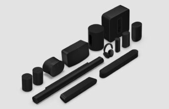 Sonos 27 adds AI control and a refreshed app Black Sonos speakers, soundbars, sub, and headphones arranged on a light gray studio background