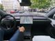 Tesla FSD Supervised Approved in Czechia Tesla cabin with a visualization map on the center screen while the car drives through a European city street