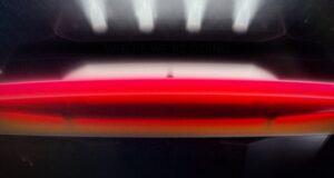 Tesla's official 'Go for launch' reveal graphic showing the red second-generation Roadster under vertical launch-pad lighting with the date 10.01