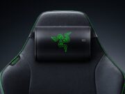 Razer Clio X wireless speaker head cushion strapped to the headrest of a black Razer gaming chair