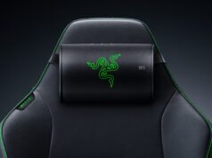 Razer Clio X wireless speaker head cushion strapped to the headrest of a black Razer gaming chair