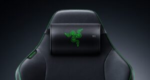 Razer Clio X wireless speaker head cushion strapped to the headrest of a black Razer gaming chair