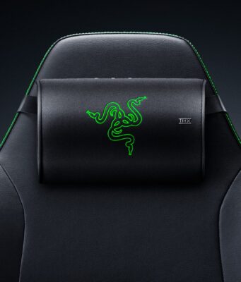 Razer Clio X wireless speaker head cushion strapped to the headrest of a black Razer gaming chair