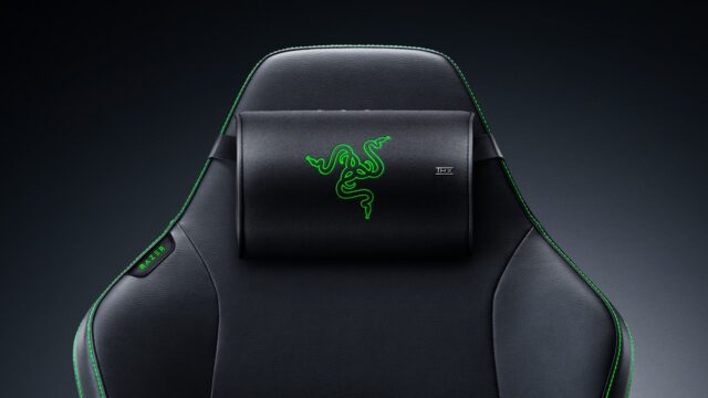 Razer Clio X wireless speaker head cushion strapped to the headrest of a black Razer gaming chair