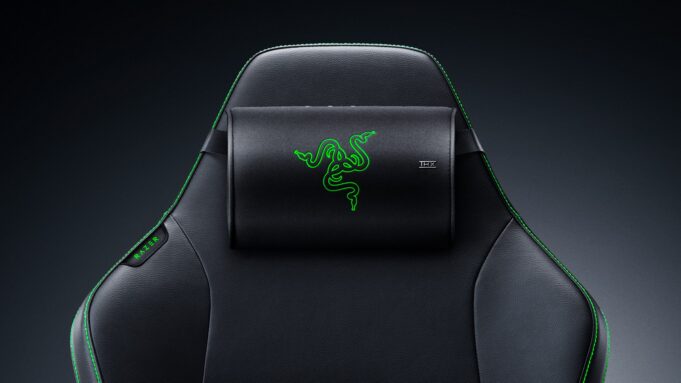 Razer Clio X wireless speaker head cushion strapped to the headrest of a black Razer gaming chair