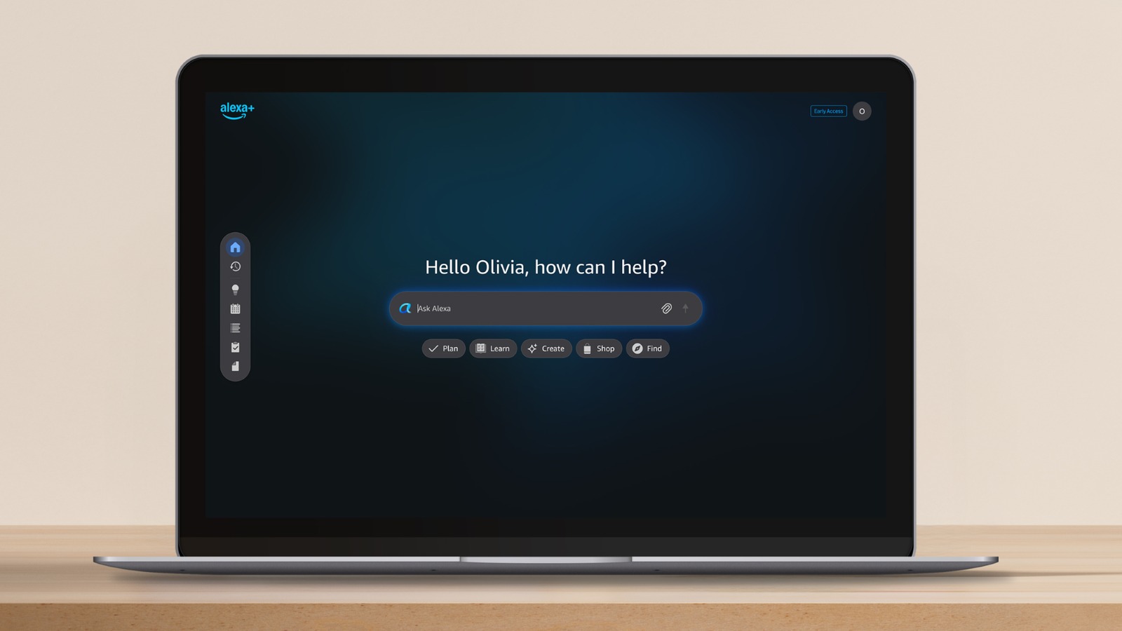 Laptop screen showing the Alexa.com web interface with the greeting Hello Olivia, how can I help and an Ask Alexa prompt bar