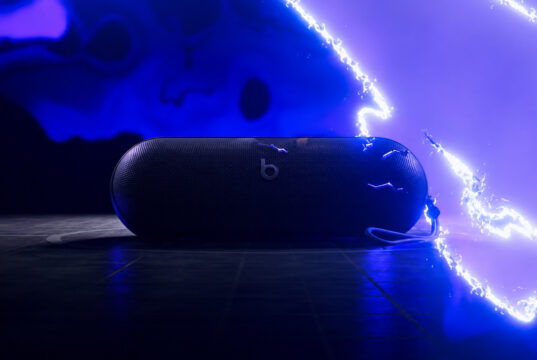 AI-relit illustration of the Beats Pokémon Pill teaser, showing the speaker and strap against blue electrical effects