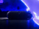 Beats Pokémon Pill Teaser Leaves Price and Date Unconfirmed AI-relit illustration of the Beats Pokémon Pill teaser, showing the speaker and strap against blue electrical effects