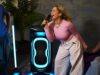 JBL PartyBox Ultimate 2 lighting a karaoke session with blue floor projection