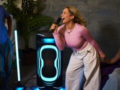 JBL PartyBox Ultimate 2 lighting a karaoke session with blue floor projection
