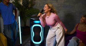 JBL PartyBox Ultimate 2 Hits 1,500 Watts With a Light Show JBL PartyBox Ultimate 2 lighting a karaoke session with blue floor projection