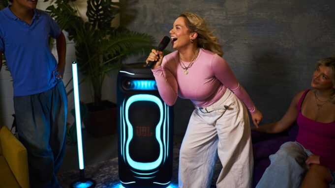 JBL PartyBox Ultimate 2 lighting a karaoke session with blue floor projection