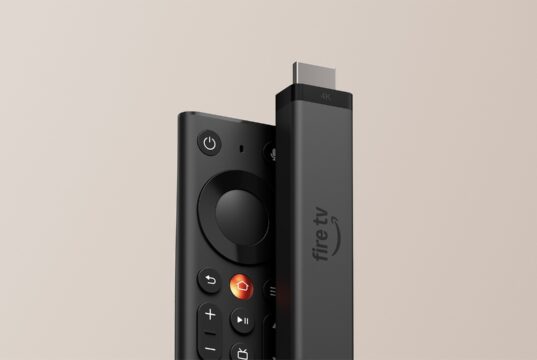 Fire TV Stick 4K standing next to the new Fire TV Remote against a beige background