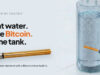 Heatbit Bitwater Turns a Water Heater Into a Bitcoin Miner Heatbit Bitwater heating element beside a transparent water tank in an official product illustration