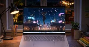HP OmniBook 5 Brings OLED to $699.99, but the Best Screen Comes in 2027 HP OmniBook 5 OLED laptop on a desk at night showing an animated city scene on its screen