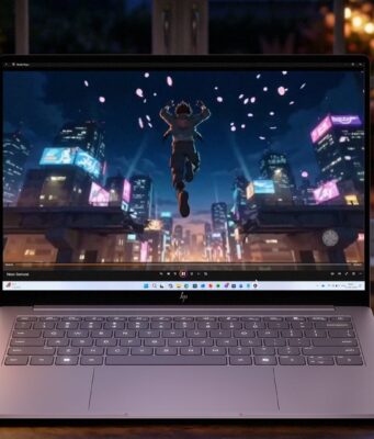 HP OmniBook 5 Brings OLED to $699.99, but the Best Screen Comes in 2027 HP OmniBook 5 OLED laptop on a desk at night showing an animated city scene on its screen