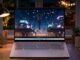 HP OmniBook 5 Brings OLED to $699.99, but the Best Screen Comes in 2027 HP OmniBook 5 OLED laptop on a desk at night showing an animated city scene on its screen