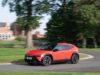 Hyundai Ioniq 3 Goes On Sale in the UK With EV Grant Red Hyundai IONIQ 3 electric hatchback driving on a UK road