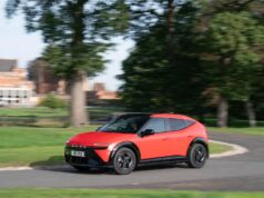 Hyundai Ioniq 3 Goes On Sale in the UK With EV Grant Red Hyundai IONIQ 3 electric hatchback driving on a UK road