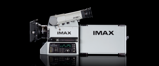 imax-70mm-vs-digital-imax-hero An IMAX film camera and its film magazine, photographed on a black background