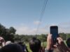 People watch the Project Suncatcher Transporter-18 launch from the ground