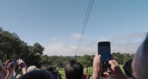 People watch the Project Suncatcher Transporter-18 launch from the ground