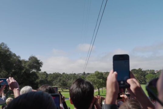People watch the Project Suncatcher Transporter-18 launch from the ground