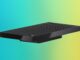 Surface RTX Spark Dev Box Pre-Orders Open at $5,999.99 Surface RTX Spark Dev Box angled on a blue, purple and yellow gradient backdrop, showing the perforated top and the Microsoft logo