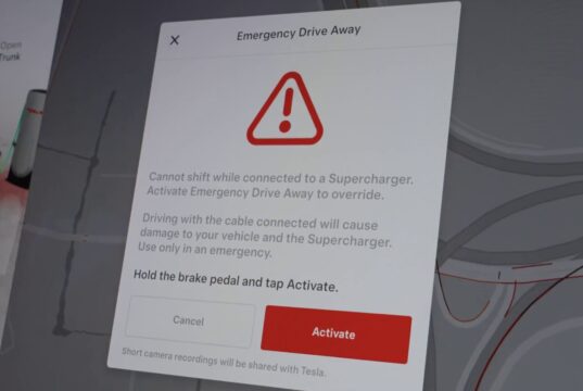 Tesla Emergency Drive Away dialog with a warning triangle, instructions to hold the brake and tap Activate, and a note about camera recordings