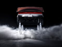 Tesla Roadster Thrust Reservation Hits $250,000 Ahead of 2028 Production Target Rear view of the redesigned Tesla Roadster with its active wing deployed, four underbody suction fans, and cold-gas thrusters firing white plumes