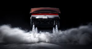 Tesla Roadster Thrust Reservation Hits $250,000 Ahead of 2028 Production Target Rear view of the redesigned Tesla Roadster with its active wing deployed, four underbody suction fans, and cold-gas thrusters firing white plumes