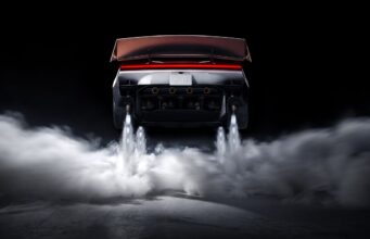 Tesla Roadster Thrust Reservation Hits $250,000 Ahead of 2028 Production Target Rear view of the redesigned Tesla Roadster with its active wing deployed, four underbody suction fans, and cold-gas thrusters firing white plumes