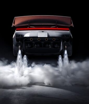 Tesla Roadster Thrust Reservation Hits $250,000 Ahead of 2028 Production Target Rear view of the redesigned Tesla Roadster with its active wing deployed, four underbody suction fans, and cold-gas thrusters firing white plumes