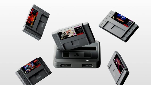 tmm-analogue-super-nt-plus-hero Black Analogue Super Nt+ FPGA console with Chrono Trigger and four Super Nintendo cartridges floating above the cartridge slot