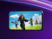 Fortnite Returns to Australia’s App Store After Court Order Official Fortnite artwork showing four characters on a landscape phone against a purple background