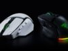 Razer Basilisk V4 Pro gaming mouse in white and black, shown side by side on a dark background